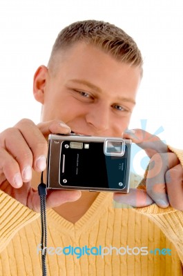 Young Man Holding Digital Camera Stock Photo