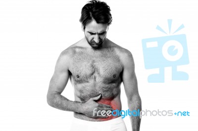 Young Man Holding His Sick Stomach Stock Photo