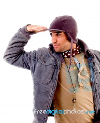 Young Man Looking Sideways With Hand Gesture Stock Photo