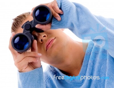 Young Man Looking Through Binocular Stock Photo
