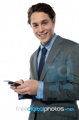 Young Man On His Smartphone Stock Photo