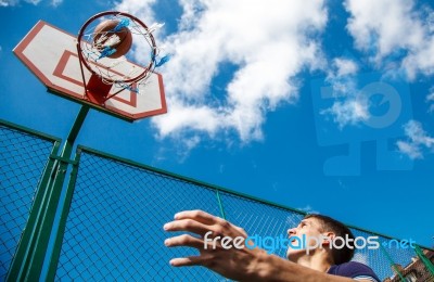 Young Man Playing Basketball Stock Photo