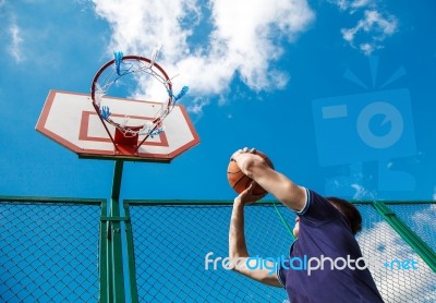 Young Man Playing Basketball Stock Photo