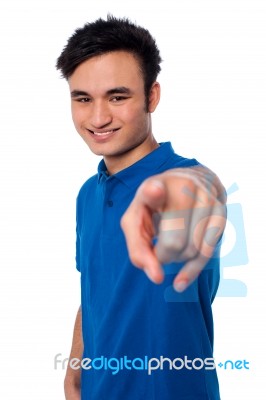Young Man Pointing Finger At You Stock Photo