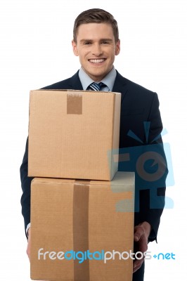 Young Man Posing With Cardboard Boxes Stock Photo
