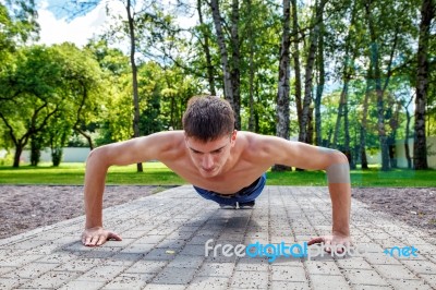 Young Man Practicing Of Push-up Stock Photo