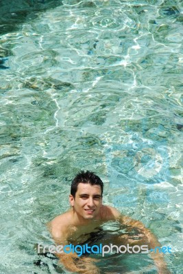 Young Man Relaxing And Smiling In Maldives (ocean Background) Stock Photo