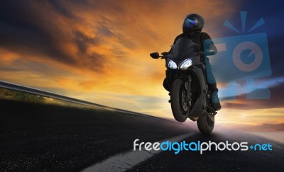 Young Man Riding Motorcycle On Asphalt Highways Road With Profes… Stock Photo