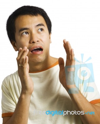 Young Man Scared Or Frightened Stock Photo