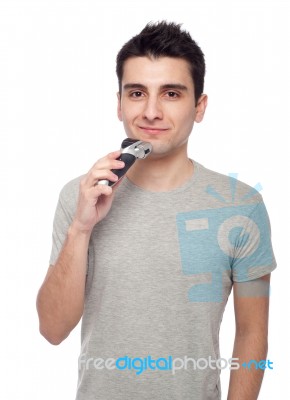 Young Man Shaving Stock Photo