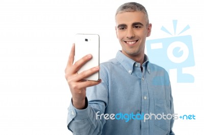 Young Man  Taking A Picture Of You Stock Photo