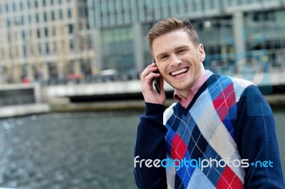 Young Man Talking On The Cell Phone Stock Photo