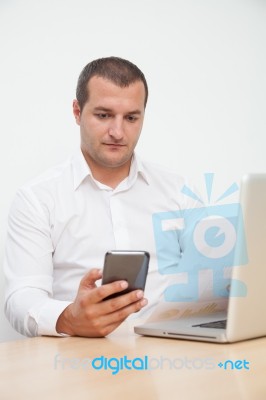 Young Man Using Tablet And Mobile Phone Stock Photo