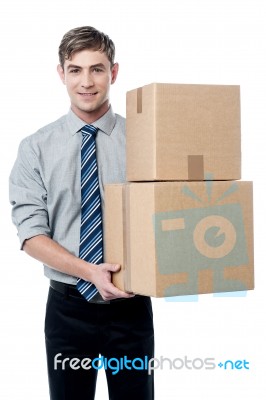 Young Man With With Stack Of Boxes Stock Photo