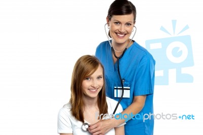 Young Patient Being Examined By A Cheerful Doctor Stock Photo