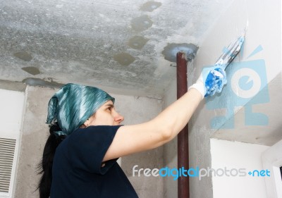 Young Pretty Woman Gets Plaster Wall Stock Photo