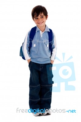 Young School Boy Smiling And Looking Away Stock Photo
