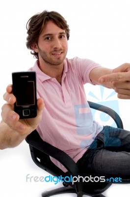 Young Sitting Male Showing Mobile Stock Photo