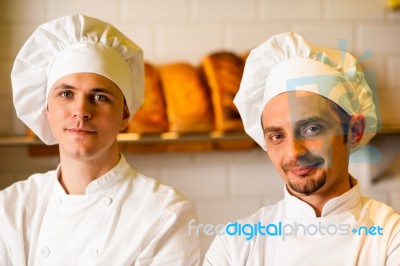 Young Smiling Chefs Posing In Bakery Stock Photo Young Smiling Chefs Posing In Bakery Stock Photo