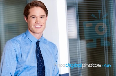 Young Smiling Relaxed Corporate Guy Stock Photo