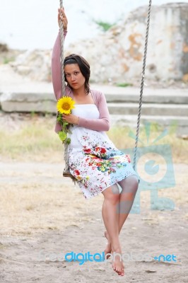 Young White Dreaming Girl With Sunflower Stock Photo