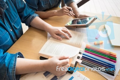 Young Woman And Man Studying For A Test/ An Exam. Tutor Books Wi… Stock Photo