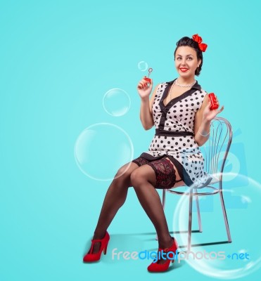Young Woman Blowing Bubbles Indoor Stock Photo