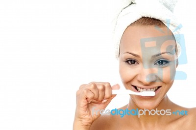 Young Woman Brushing Her Teeth Stock Photo