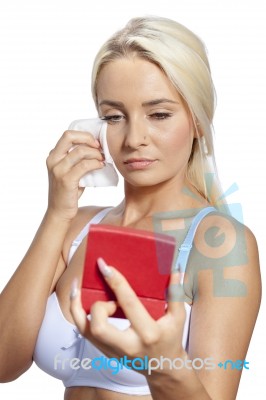 Young Woman Clean Face With Wet Wipes And Holding Mirror Stock Photo