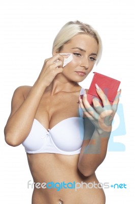 Young Woman Clean Face With Wet Wipes, Looking On Mirror In Hand… Stock Photo
