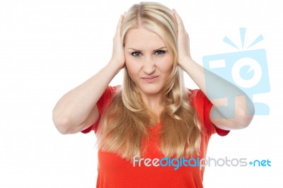 Young Woman Covering Her Ears Stock Photo