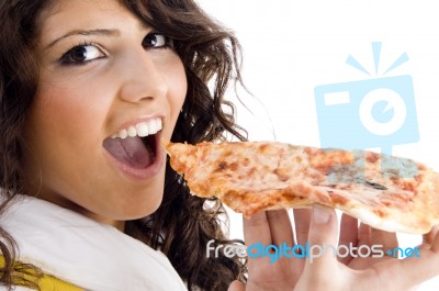 Young Woman Eating Pizza Stock Photo