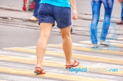 Young Woman Feet, Crossing An Urban Street Stock Photo