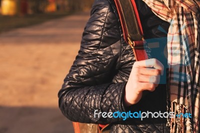 Young Woman Hand On Her Backpack, Warm Toning Stock Photo