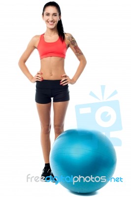 Young Woman In Gym Wear With Exercise Ball Stock Photo