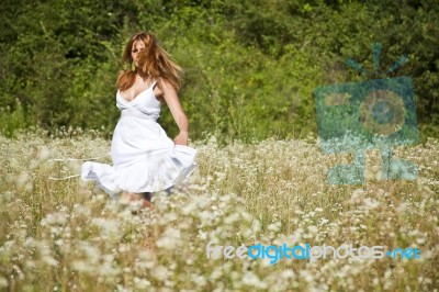 young Woman In Meadow Stock Photo young Woman In Meadow Stock Photo