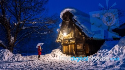 Young Woman In Shirakawa-go Village In Winter, Unesco World Heritage Sites, Japan Stock Photo