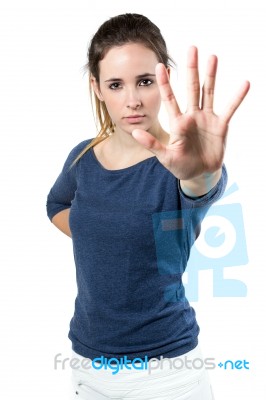 Young Woman Making Stop Sign In Front Of The Camera Stock Photo