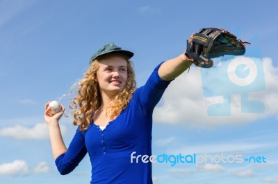 Young Woman Playing Baseball With Cap Glove And Ball Stock Photo