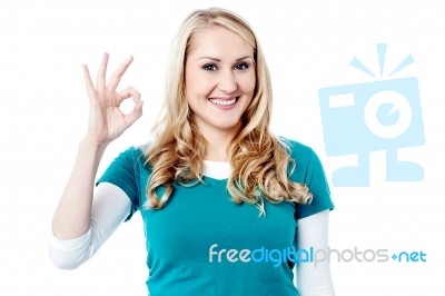 Young Woman Shows Okay Gesture Stock Photo