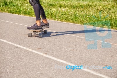 Young Woman Skateboarding In The Park Stock Photo Young Woman Skateboarding In The Park Stock Photo