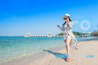Young Woman Walking On Beach In Si Chang Island, Thailand Stock Photo