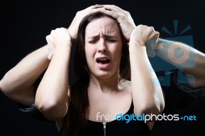 Young Woman With A Male Hands Pressing Her Head. Concept Of Oppr… Stock Photo
