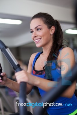 Young Woman Working Out On A Stepper Stock Photo