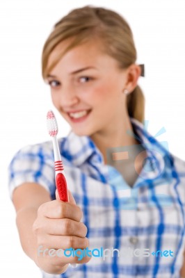 Young Women Showing The Toothbrush Stock Photo
