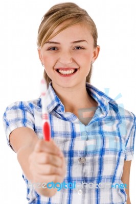 Young Women Showing Toothbrush Stock Photo