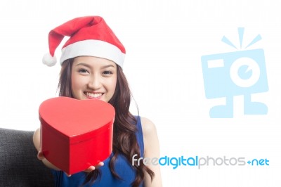 Young Women Wearing Christmas Hats Stock Photo