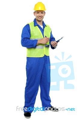 Young Worker Holding Clipboard Stock Photo