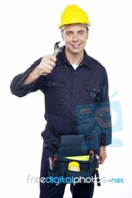 Young Worker Holding Spanner Stock Photo