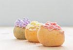 3 Color Choux Or Profiterole Or Eclair On Wood Table Oblique View Stock Photo